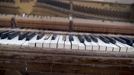 pan of old warped upright piano