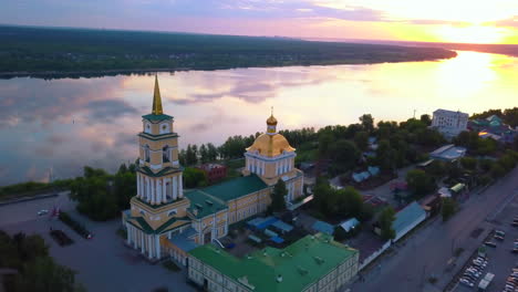 sunrise over the river with orthodox church