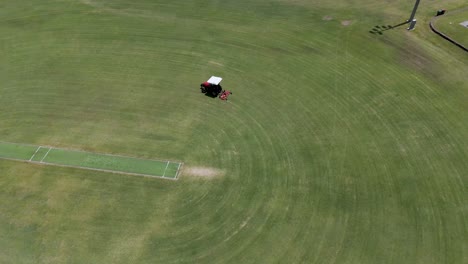 aerial view of tractor mowing a sports field