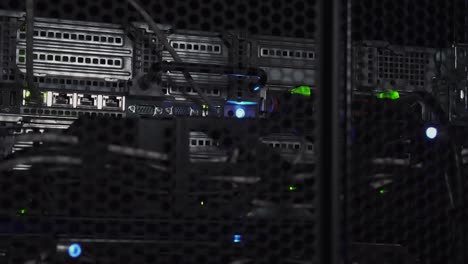 flashlight of thief shining on a data server rack