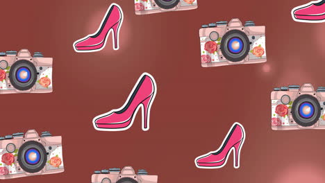 animation of pink high heels and cameras over light spots on brown background