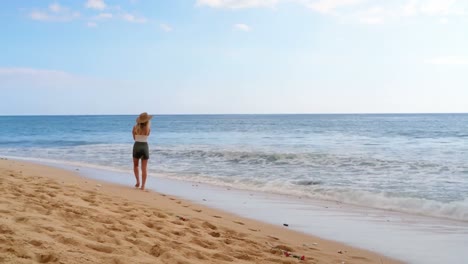 woman walking on the beach 4k