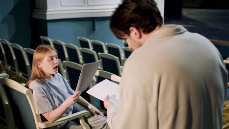 people in the theater before rehearsal