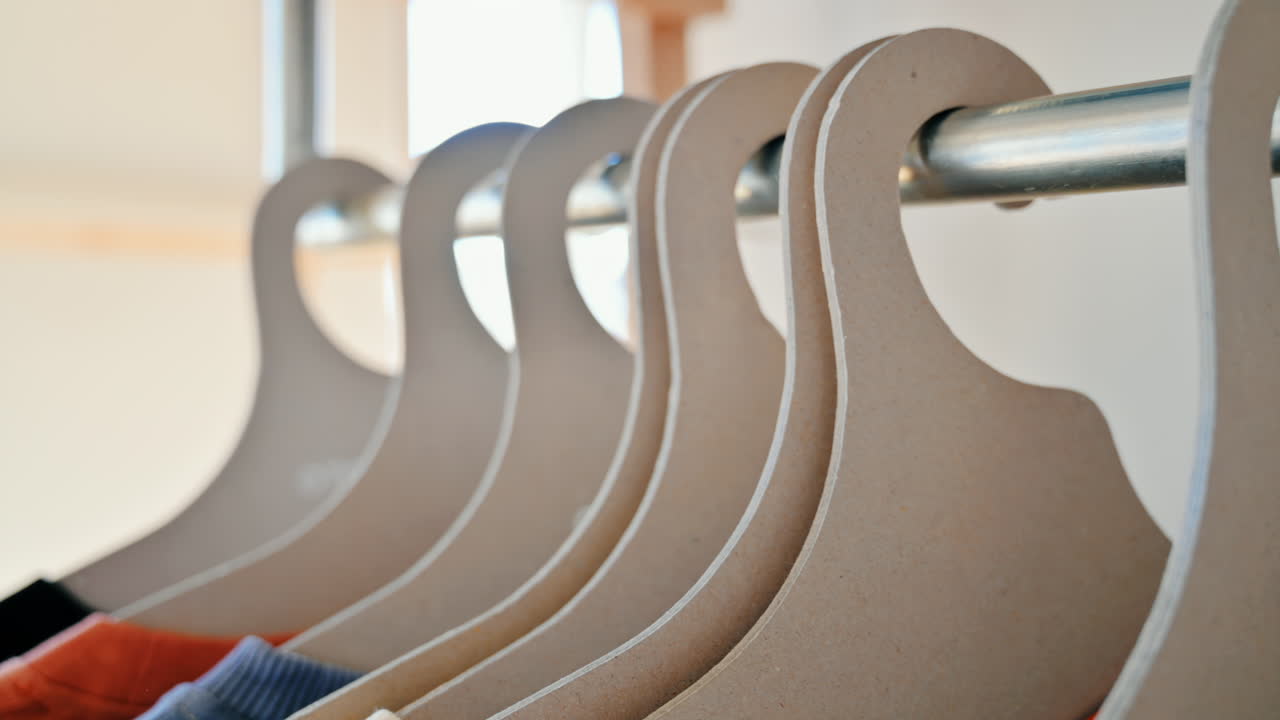 Interior of an eco-friendly shop with clothes hang on brown paper hangers