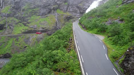 cars climb up the troll road in norway