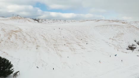 People-Having-Fun-Sledding-at-Sleeping-Bear-Dunes-National-Lakeshore-in-Michigan