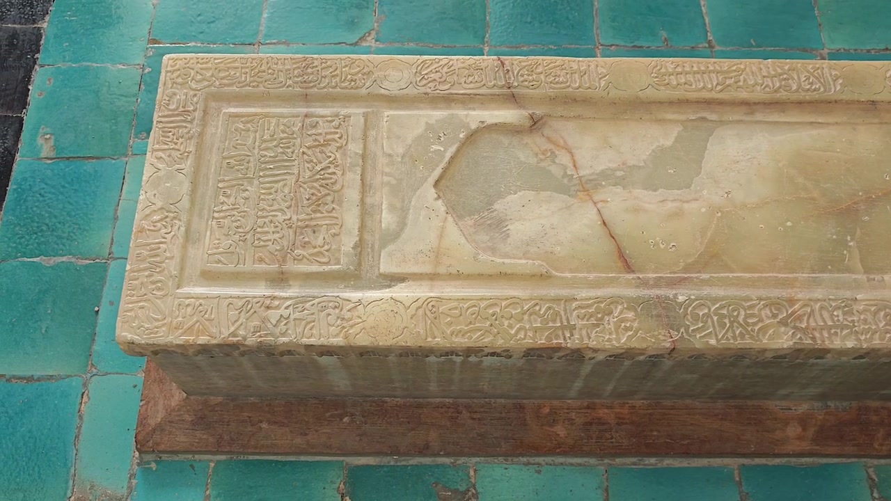 Ancient Stone Sarcophagus with Arabic Calligraphy in Historic Mausoleum