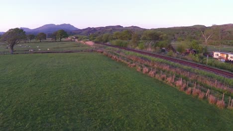 An-aerial-of-a-diesel-passenger-train-as-it-passes-through-the-English-countryside-1