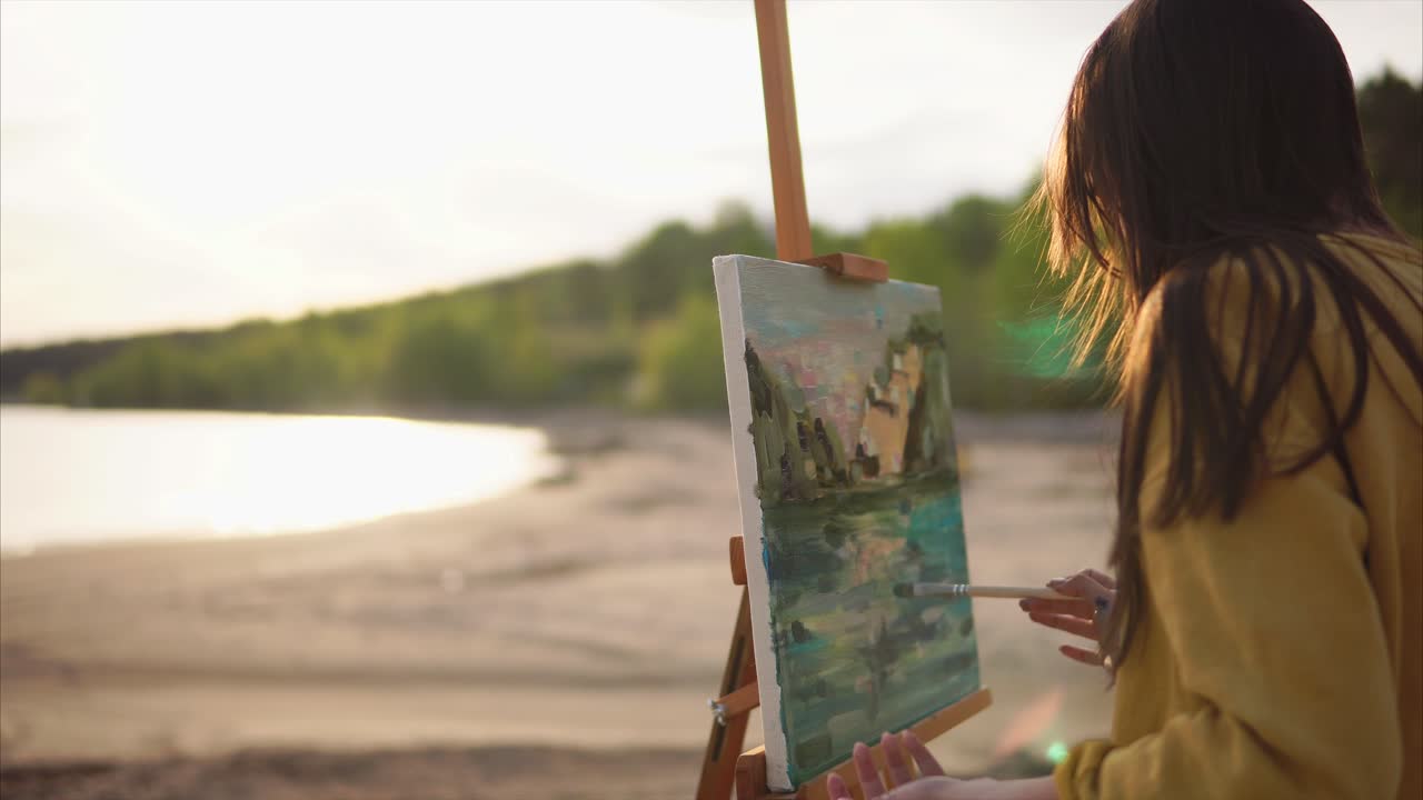 Woman Painting a Landscape at Sunset by the River