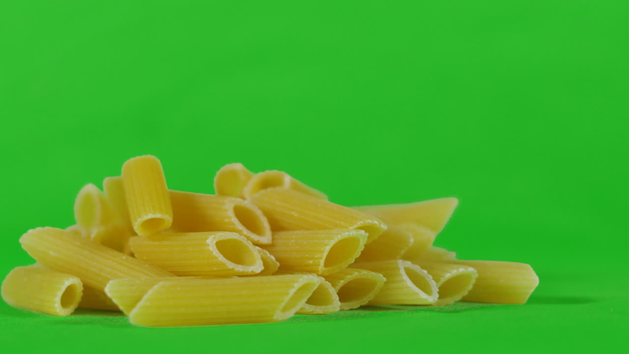 Real Italian Penne Pasta Green Screen Chromakey Background. Isolated Healthy Food Footage. ProRes 4K.