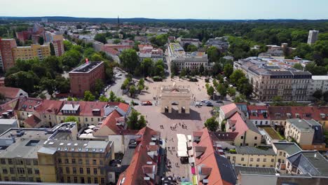 potsdam city center with historical buildings, showing brandenburger gate, street and luisenplatz square on a sunny summer day