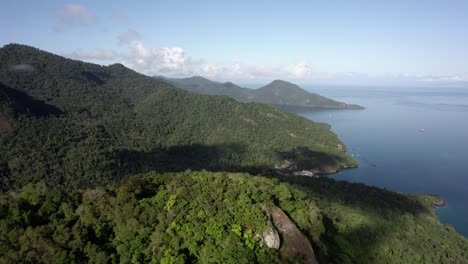 Aerial-view-the-forest-and-the-mountainous-coast-of-Ilha-Grande,-in-sunny-Brazil