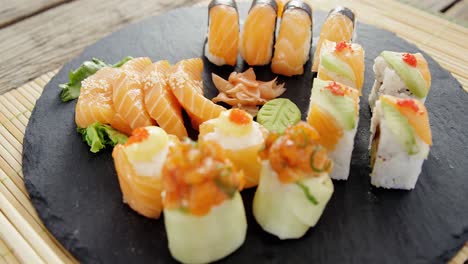 Close-up-of-various-sushi-on-tray-with-chopstick