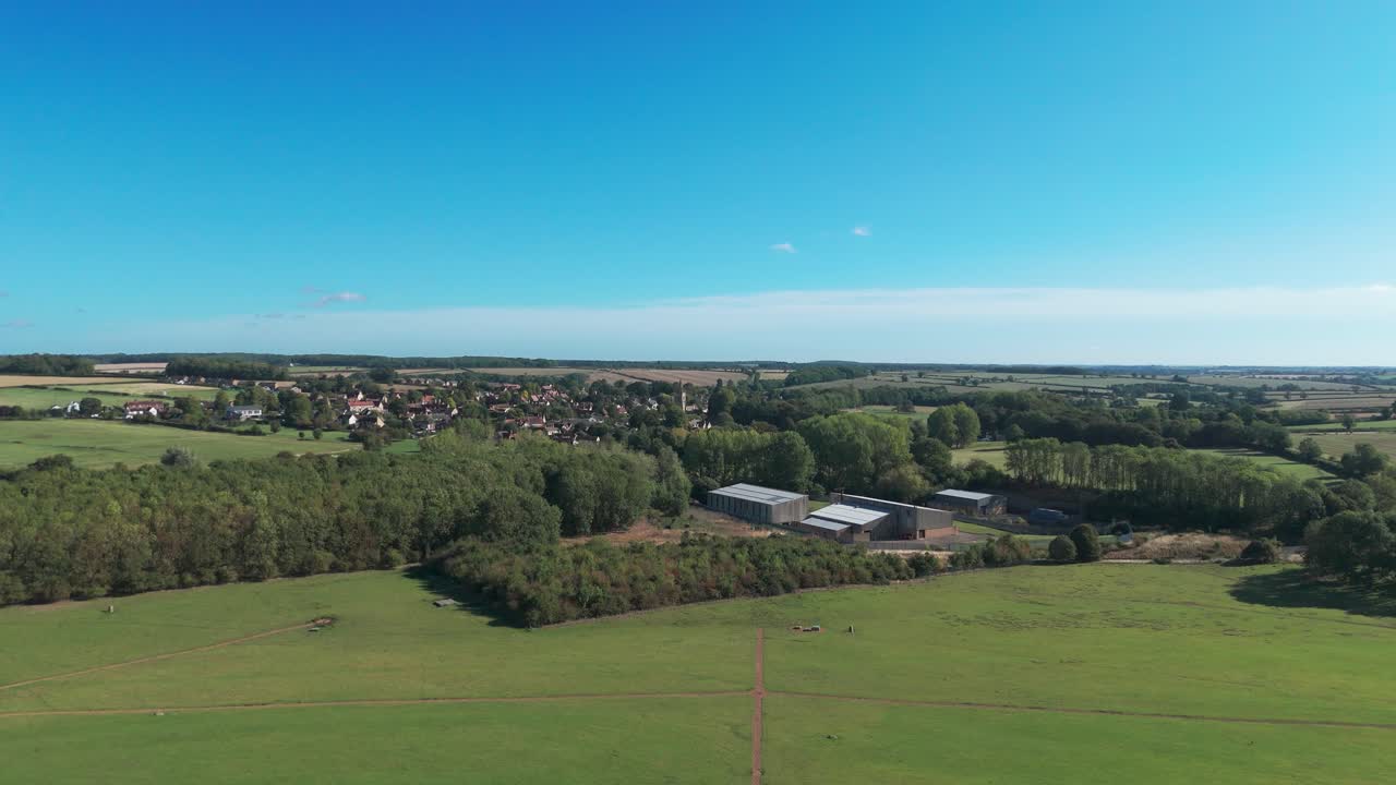 Scenic countryside with St. Peter's church in Empingham under clear sky