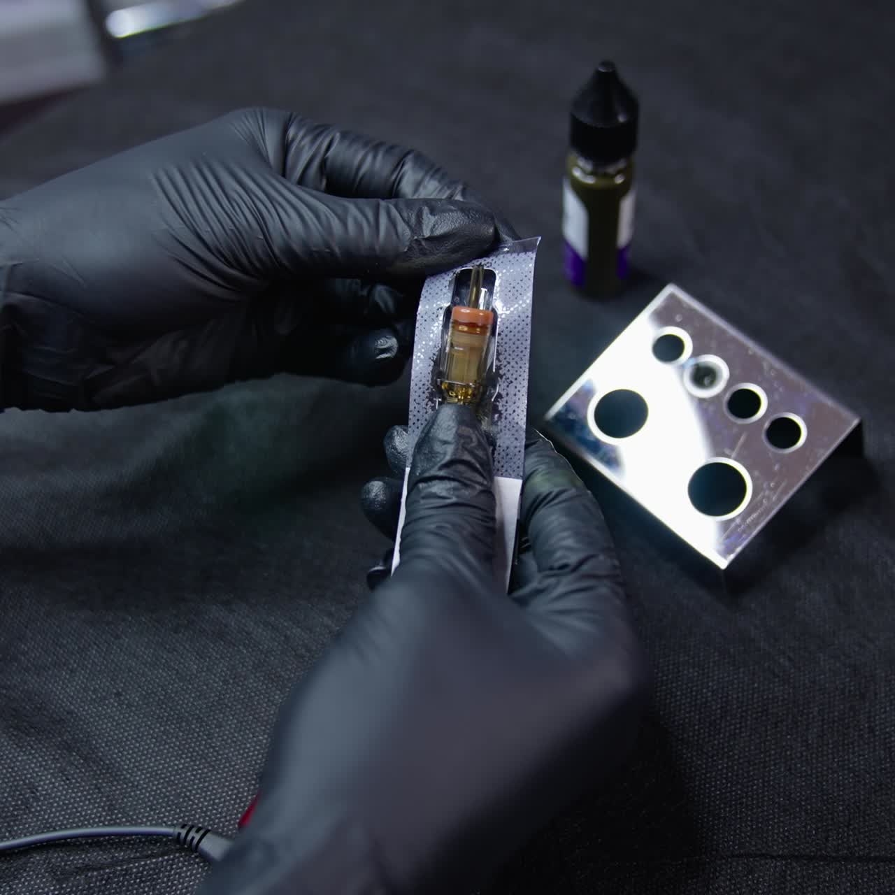 Preparing for tattoo. Unpacking new needle for eyebrow tatoo