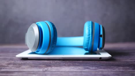 blue headphones on a tablet