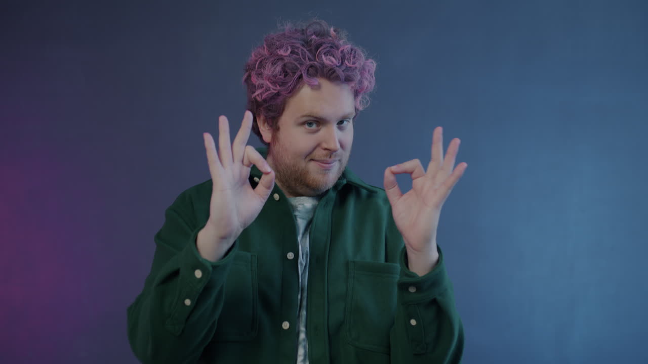 Man with Pink Hair Making an OK Gesture