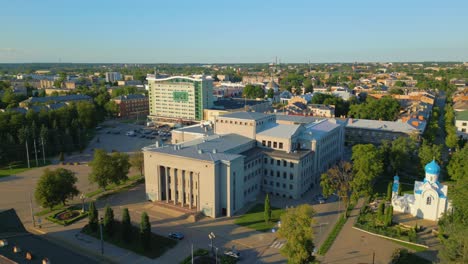 Panoramic-aerial-view-of-Unity-House-at-sunset,-Daugavpils,-Latvia