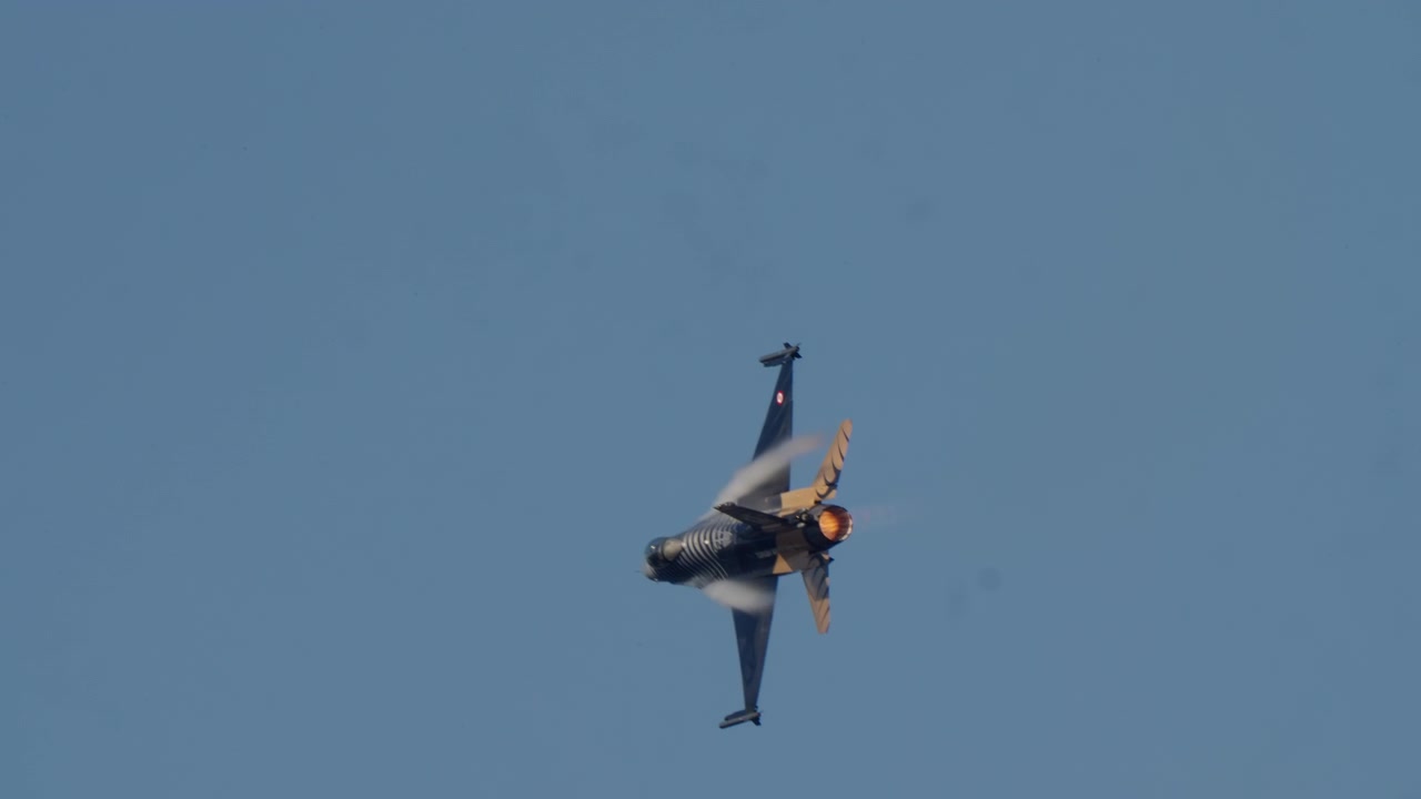 Fighter Jet Performing Maneuver with Afterburner and Vapor Trails