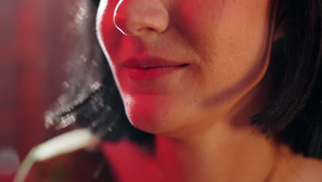 close-up of a woman's face with colorful lighting