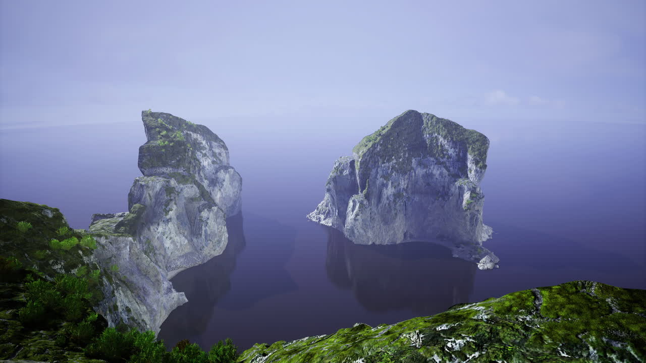 Majestic rock formations rise from calm ocean waters at sunrise