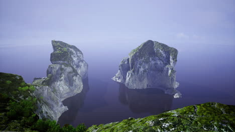 majestic rock formations rise from calm ocean waters at sunrise