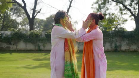 friends celebrating holi in an indian traditional outfit