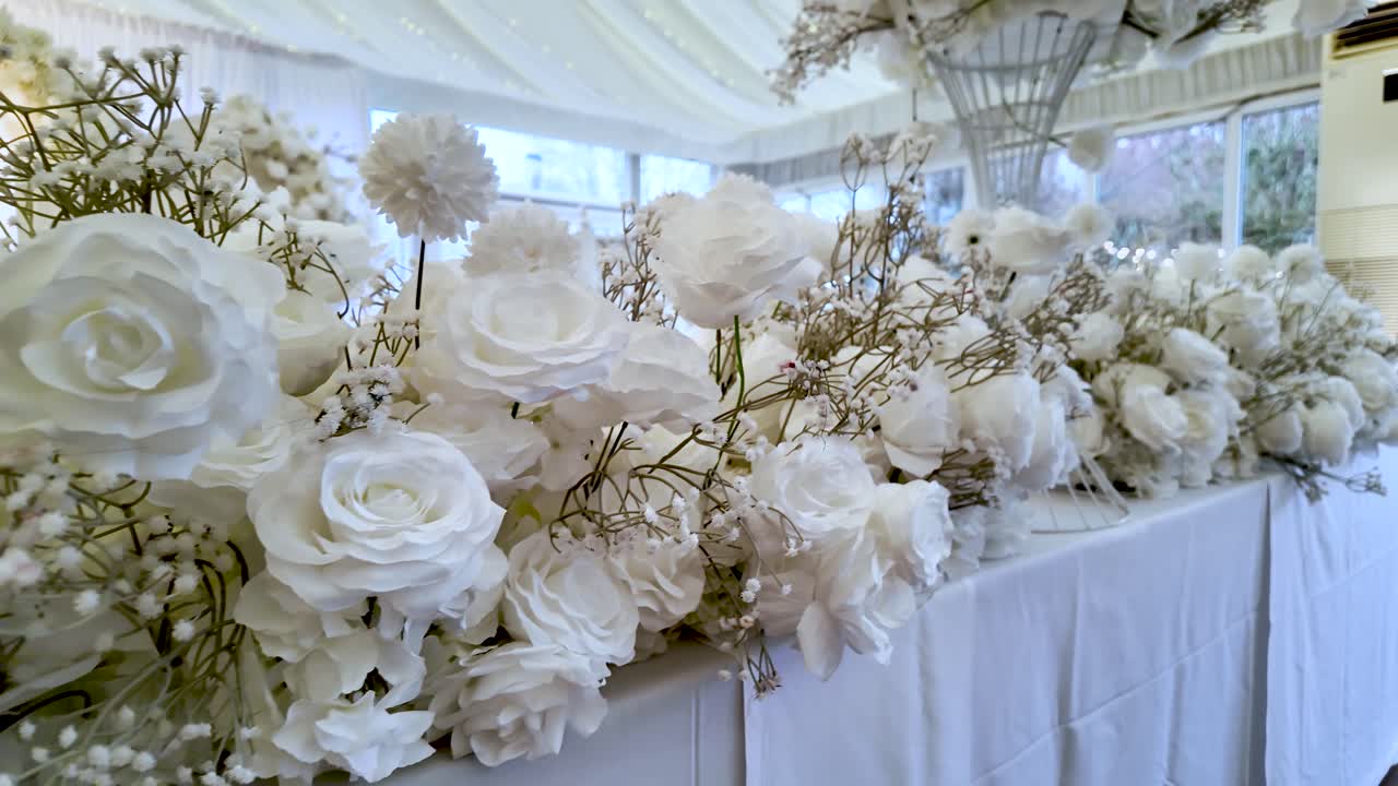 Elegant White Floral Table Arrangement For Wedding Venue Decor Featuring Roses Carnations And Baby'S Breath For Celebrations And Special Events
