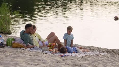 family having picnic on the beach