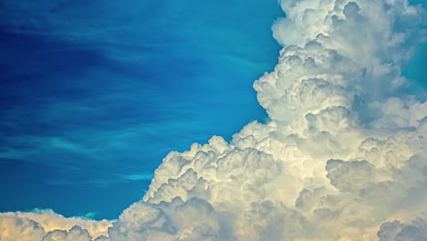 timelapse motions of puffy fluffy white clouds against blue sky