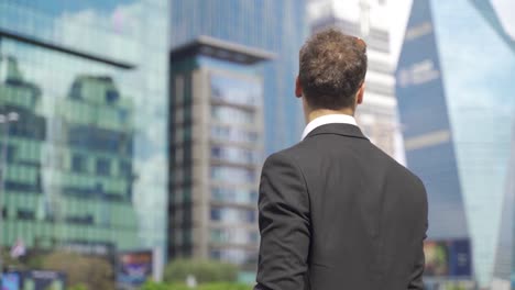 businessman looking at phone gaining opportunity and rejoicing.