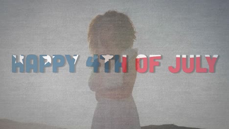 animation of happy 4th of july text with american flag pattern waving over woman on beach