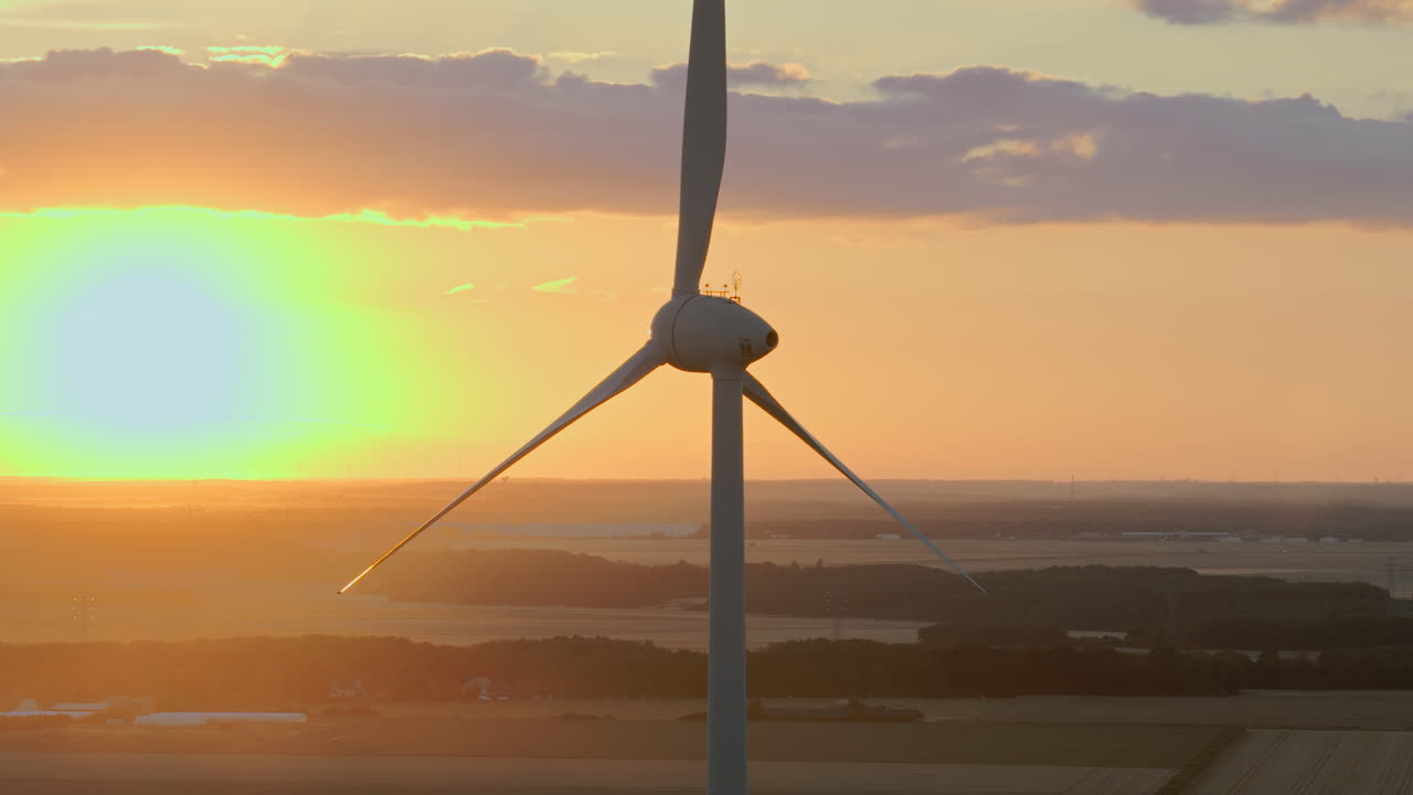 Wind Turbine at Sunset over Fields