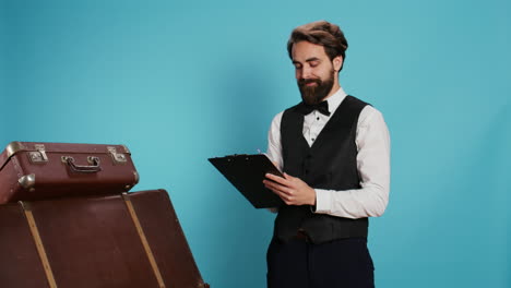 doorman verifying checklist of guests