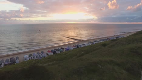 aerial: the beach between vlissingen and dishoek during sunset