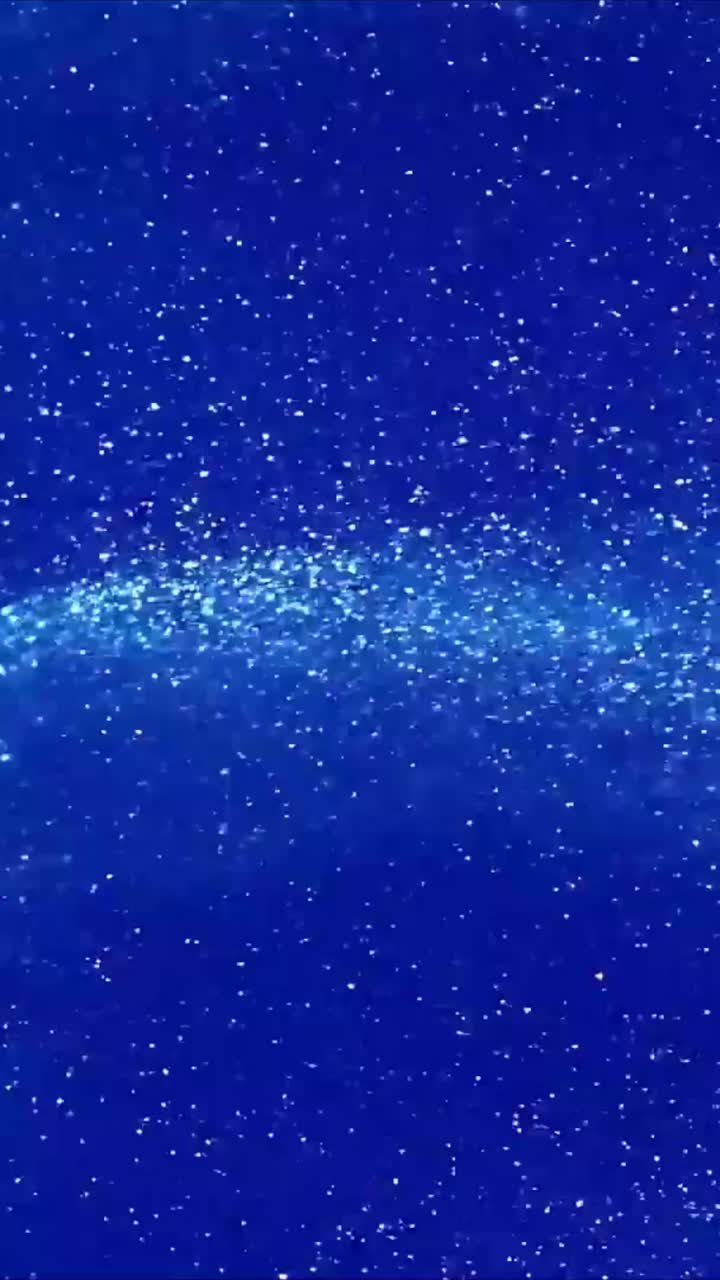 Particelle di glitter blu dinamiche che scorrono e brillano su sfondo astratto