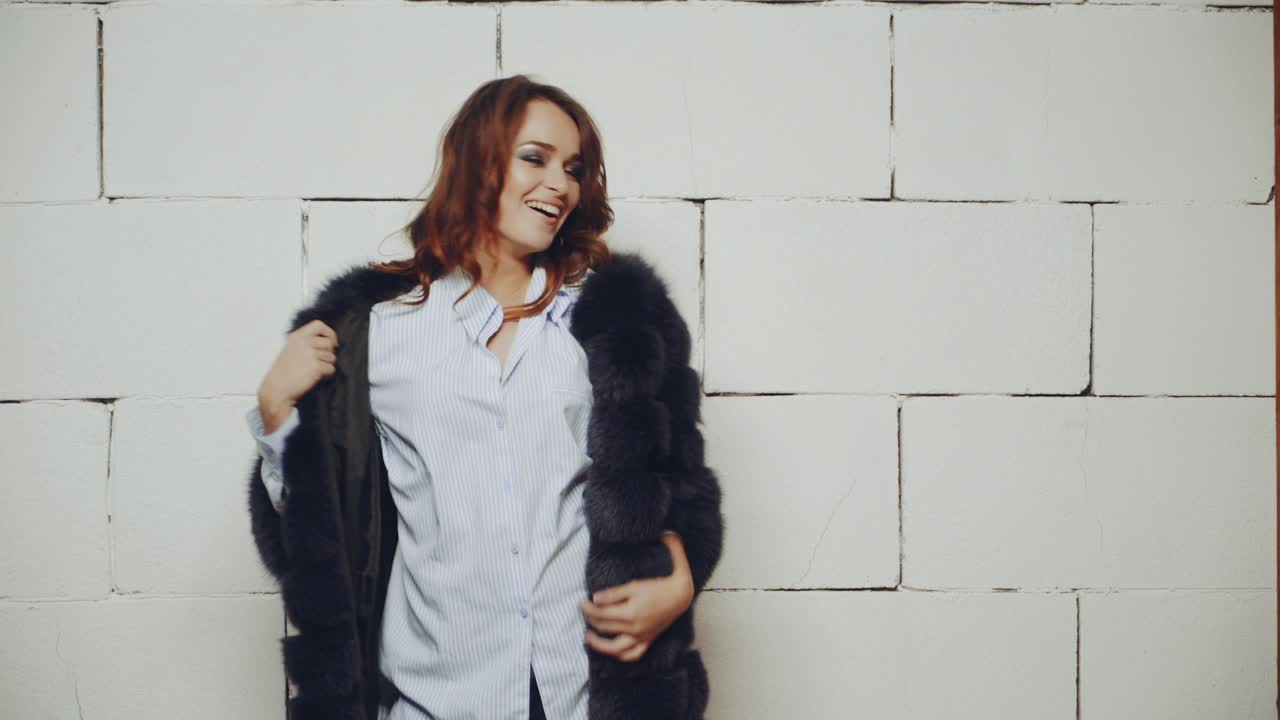 Woman posing in studio. Young fashion model girl posing in trendy wearing in studio