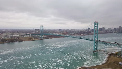 Cars-and-transport-trucks-crossing-from-Windsor-to-Detroit-via-the-Ambassador-Bridge-in-winter