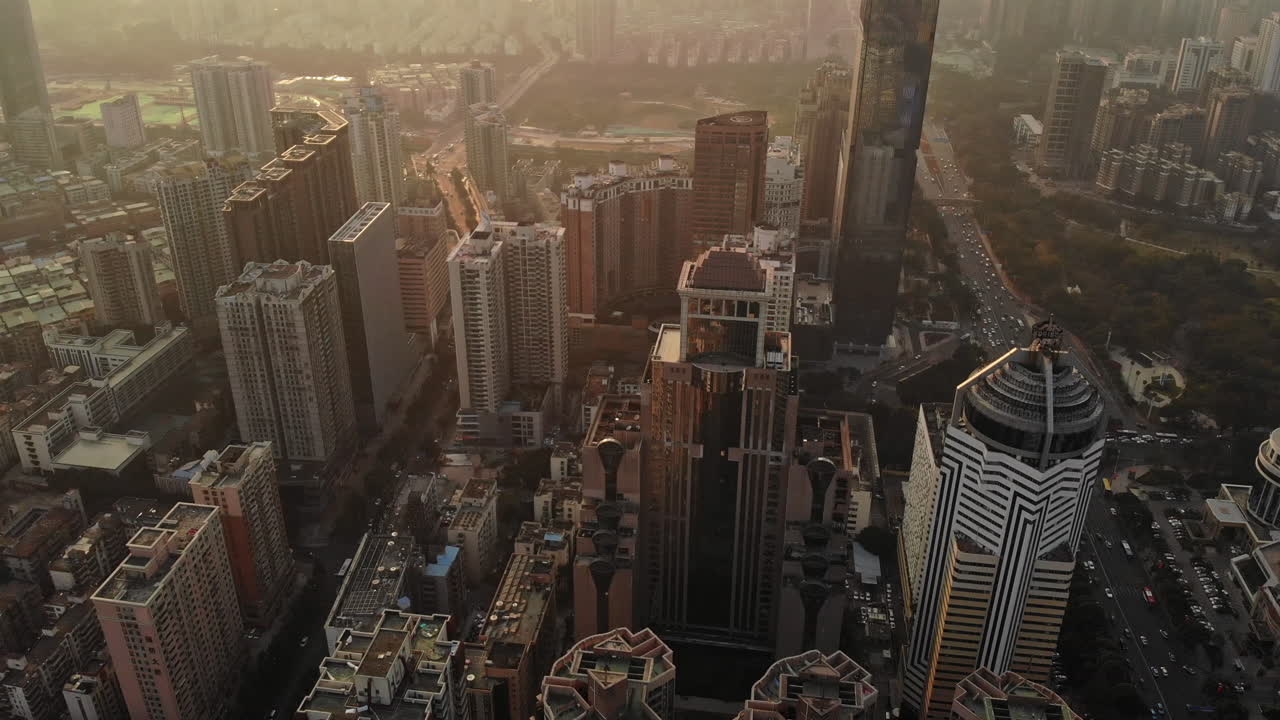 Aerial establishing shot of Shenzhen cityscape Futian District at sunset