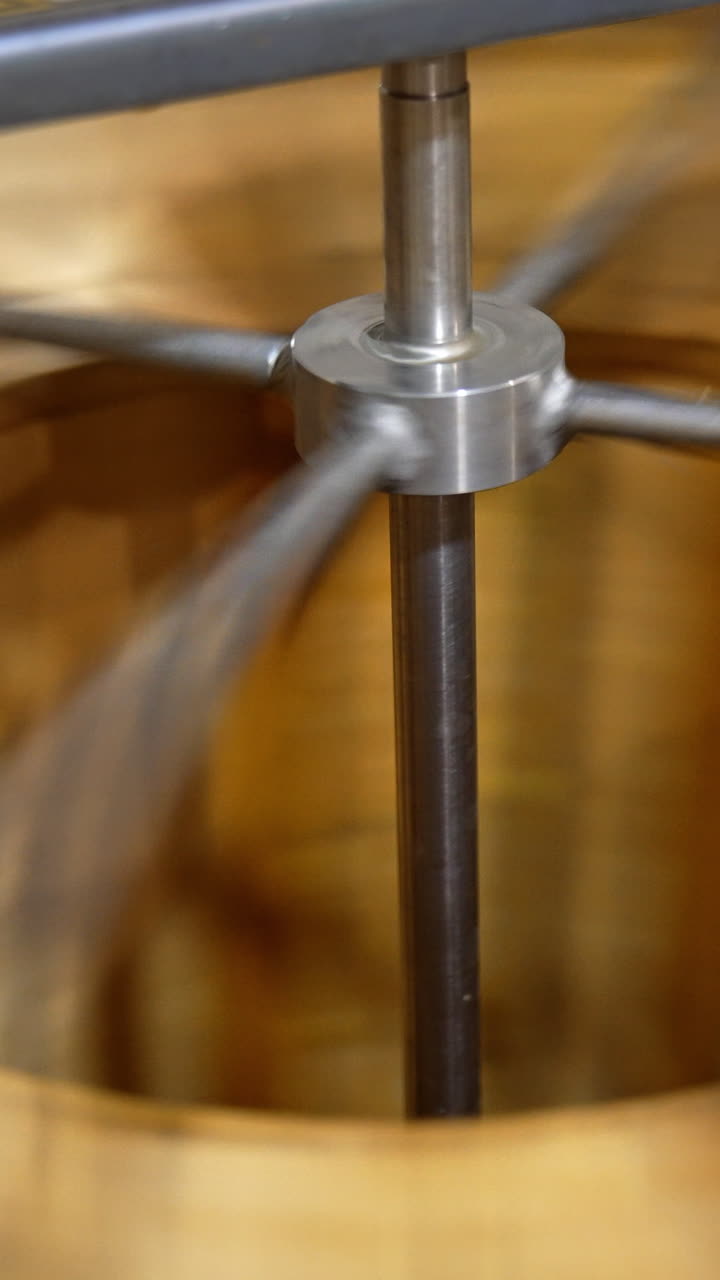 Beekeeping organic sweet producting machine. Centrifuge for harvesting honey. Vertical video