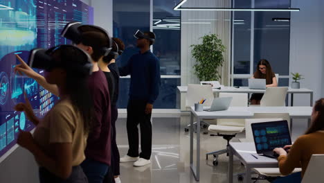people wearing vr headsets interact with a futuristic data display in a modern office