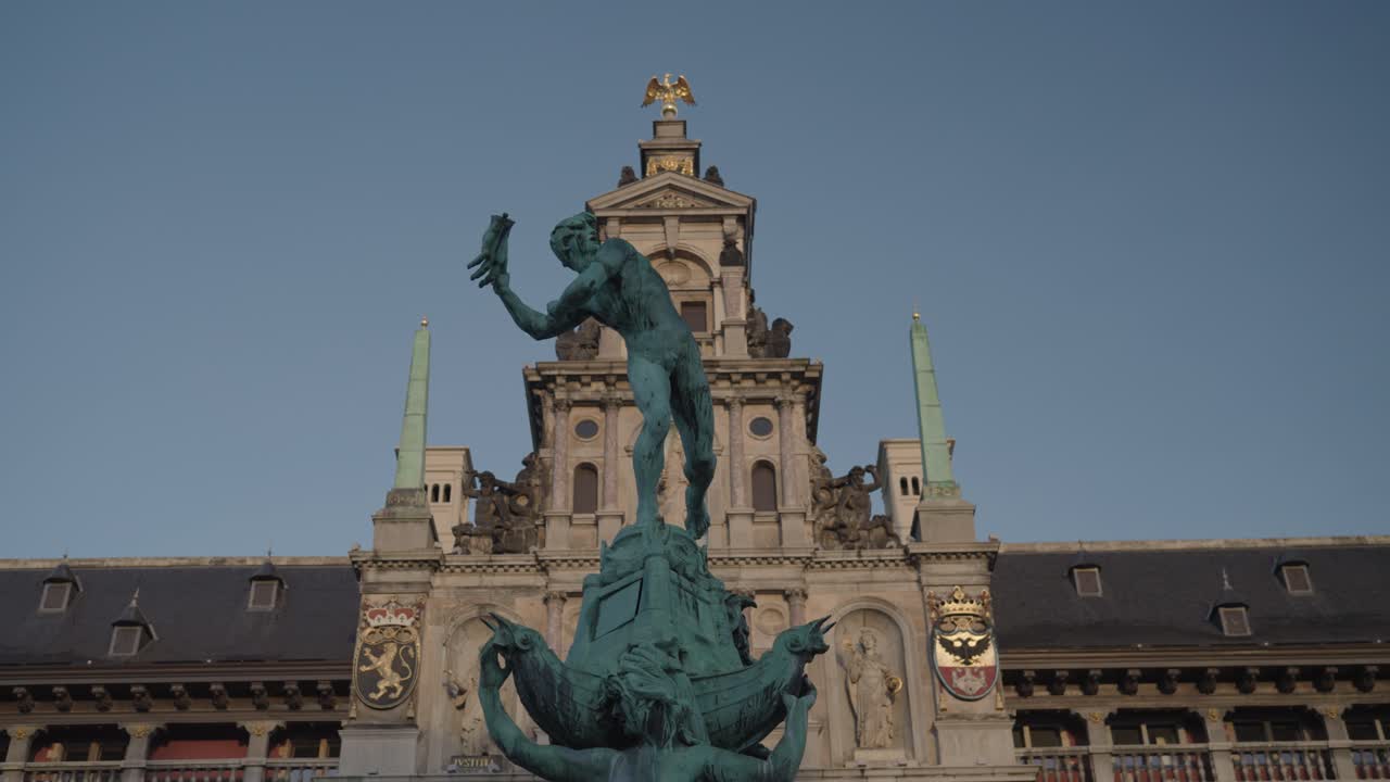 Statue in front of a city hall building