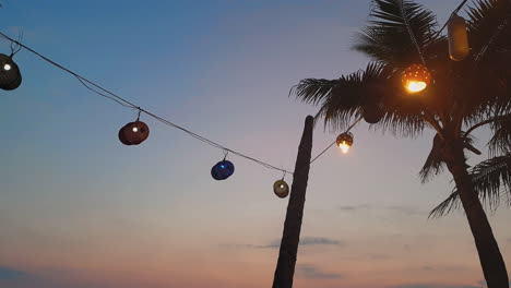 static view of lanterns hanging in a circle in magnificent sunset