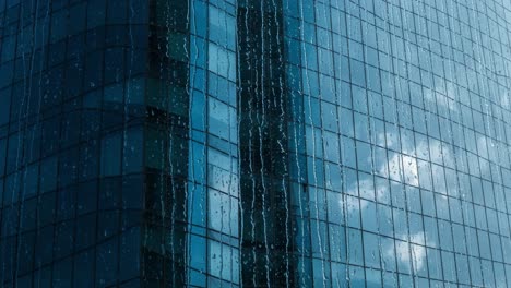 raindrops on a modern glass building facade