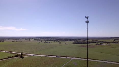Rural cell phone tower in the middle of nowhere with 5G technology updates needed stock video by aerial drone footage 7