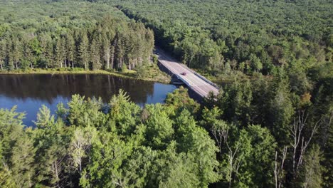 birds eye view to a rural pennsylvania road in a forest