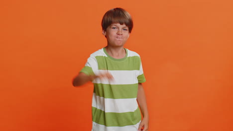 frightened child boy closing mouth with hands refusing to tell terrible secret unbelievable truth