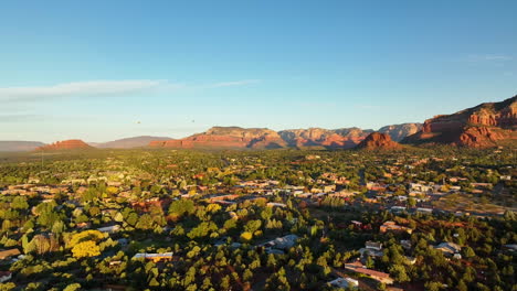 cinematic drone shot of sedona arizona with the airport mesa mountain in the distance