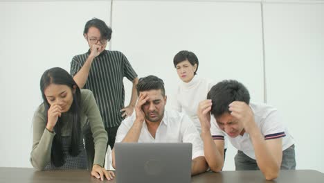 casual creative business team getting very bad news on his laptop computer screen and feeling disappoint