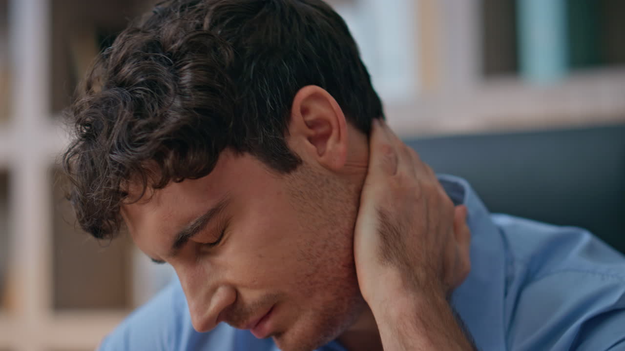 Freelancer suffering neck pain at home office closeup. Tired thoughtful manager